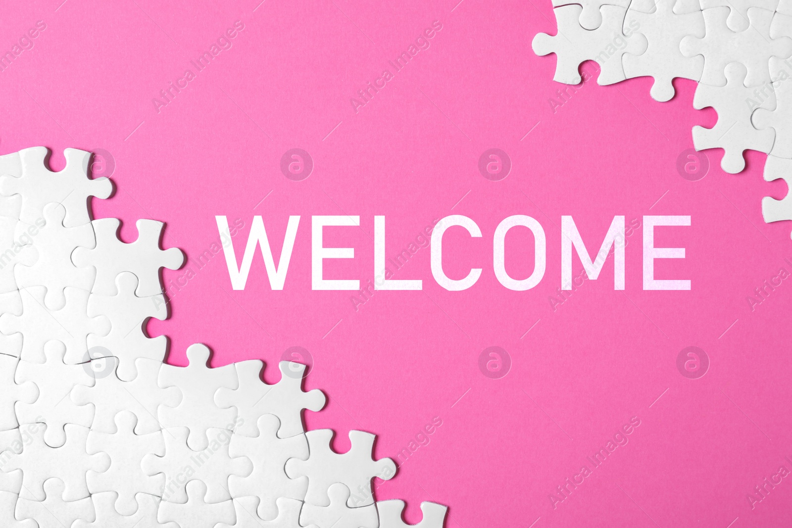 Image of White puzzle pieces and word WELCOME on pink background, flat lay