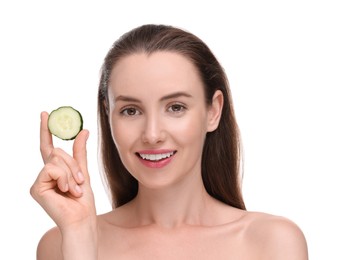 Beautiful woman with piece of cucumber on white background