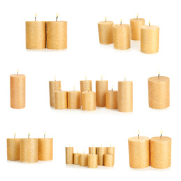 Image of Set of burning gold candles on white background