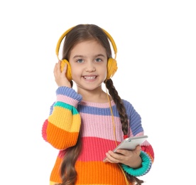 Cute little child with headphones and mobile phone on white background