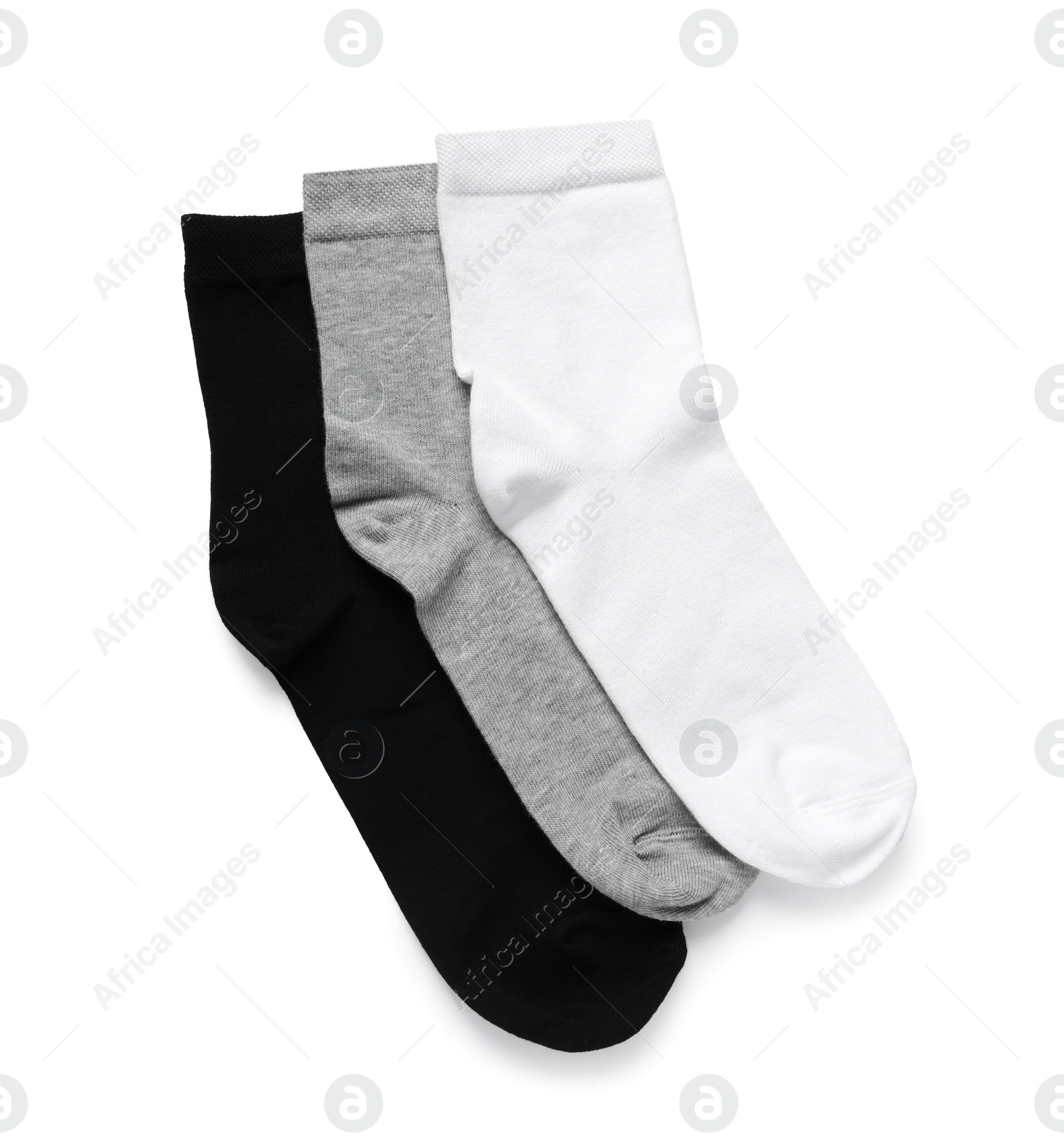 Photo of Different socks isolated on white, top view