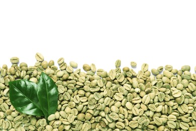 Photo of Many green coffee beans and leaves on white background, top view