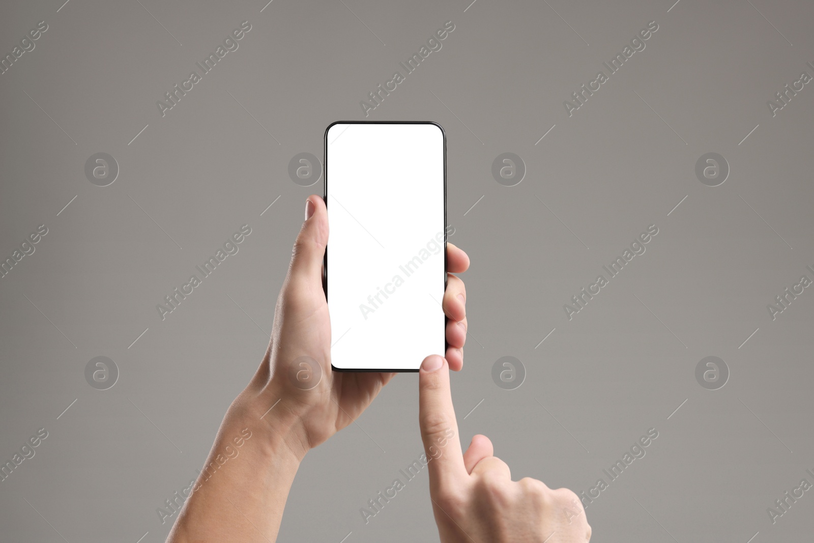 Photo of Man using smartphone with blank screen on light grey background, closeup. Mockup for design