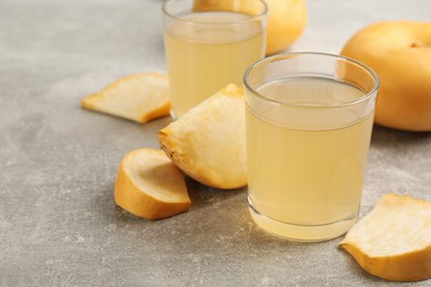 Photo of Freshly made turnip juice on light grey table