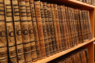 Collection of old books on shelf in library