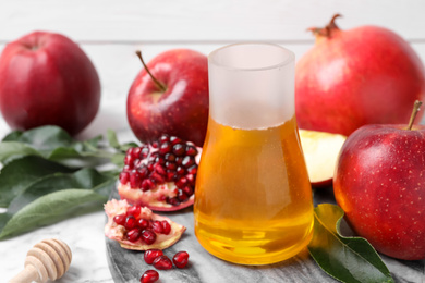 Honey, apples and pomegranate on table. Rosh Hashanah holiday