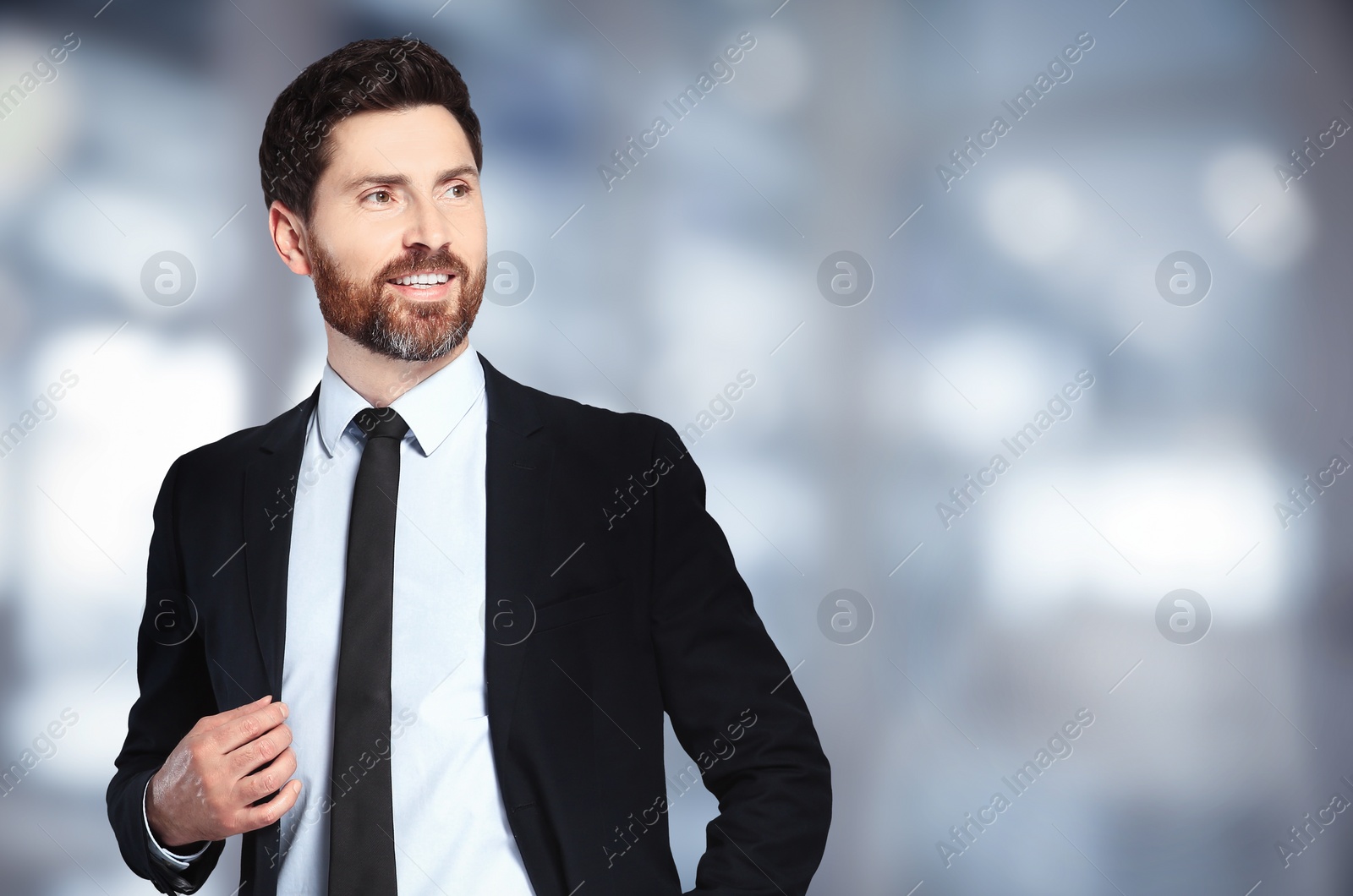 Image of Handsome real estate agent in office, space for text