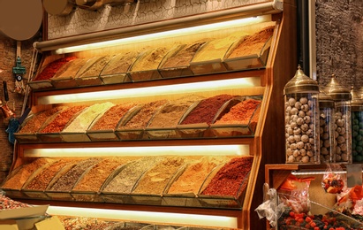 Shelves with colorful aromatic spices at market