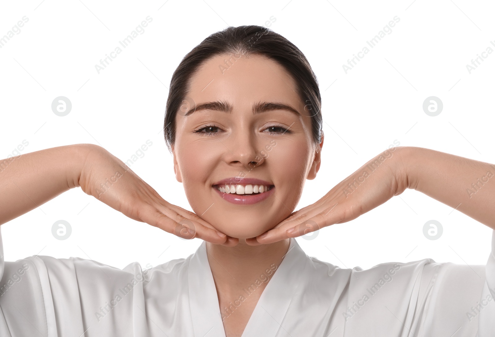 Photo of Young woman massaging her face on white background