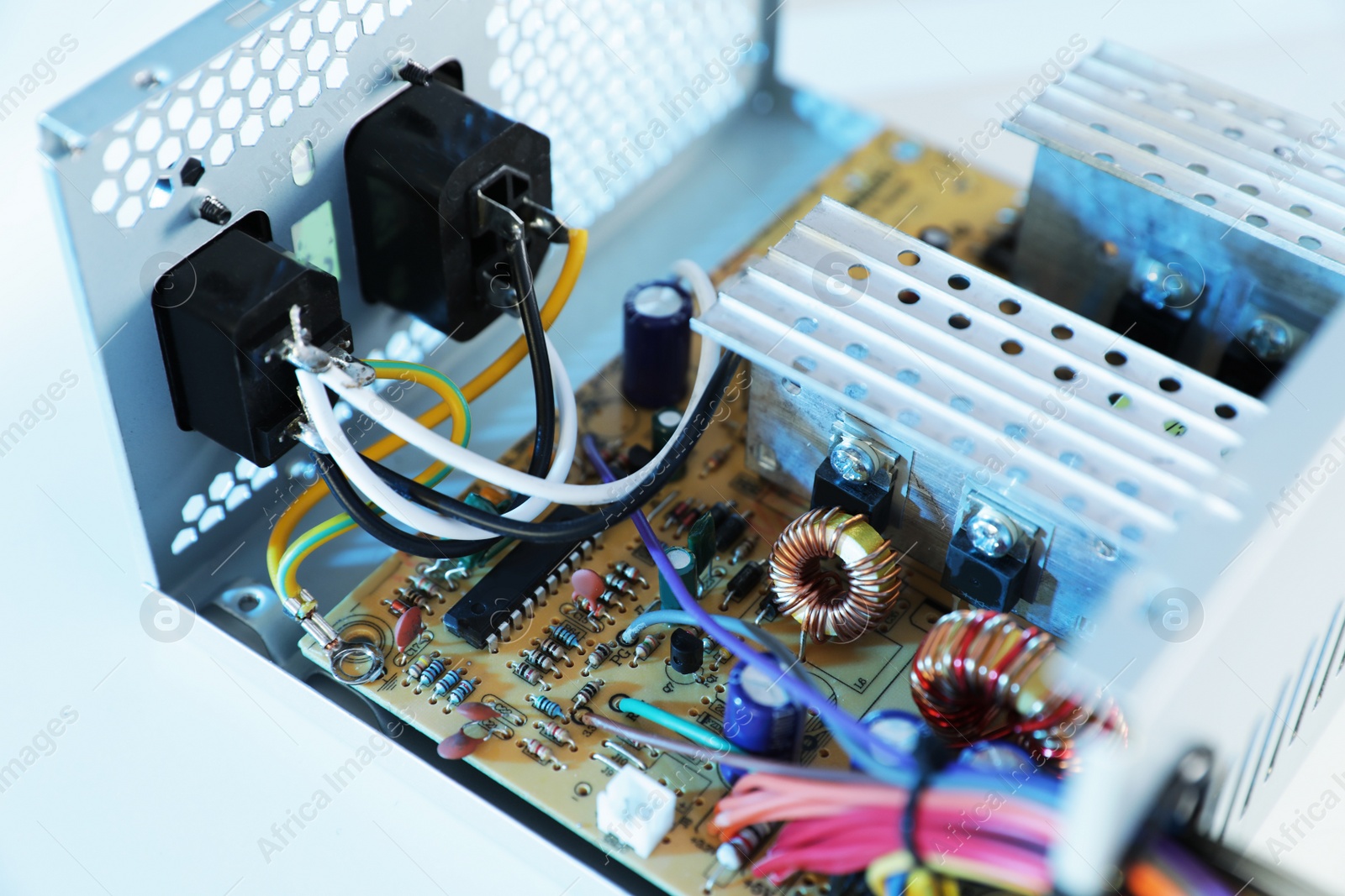 Photo of Power supply unit on table, closeup. Computer repair service