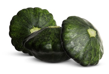 Three fresh green pattypan squashes on white background