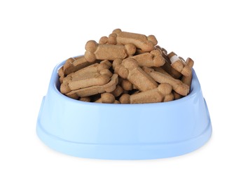 Photo of Bone shaped dog cookies in feeding bowl isolated on white