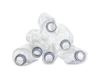 Photo of Pile of crumpled bottles isolated on white. Plastic recycling