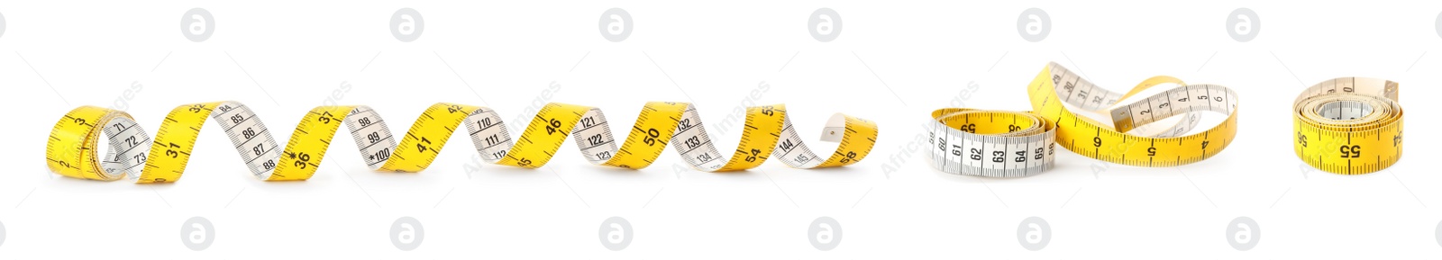 Image of Set of yellow measuring tapes on white background. Banner design