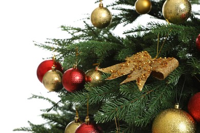 Photo of Beautifully decorated Christmas tree on white background, closeup