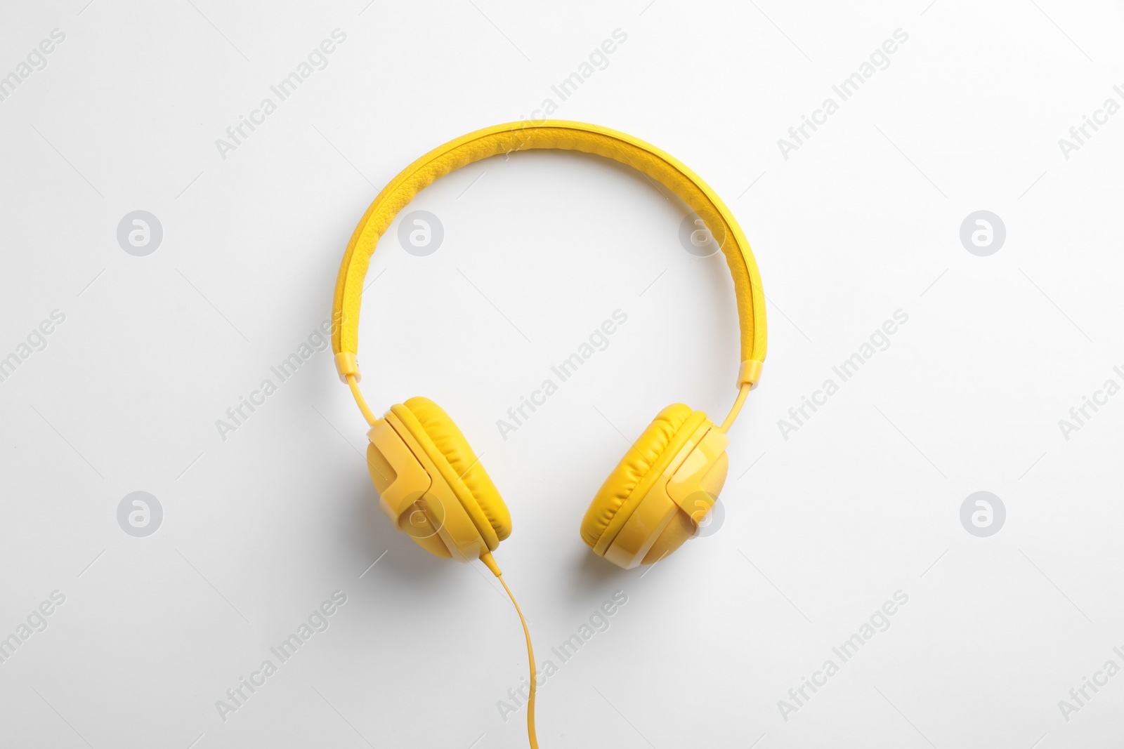 Photo of Stylish modern headphones with earmuffs on white background