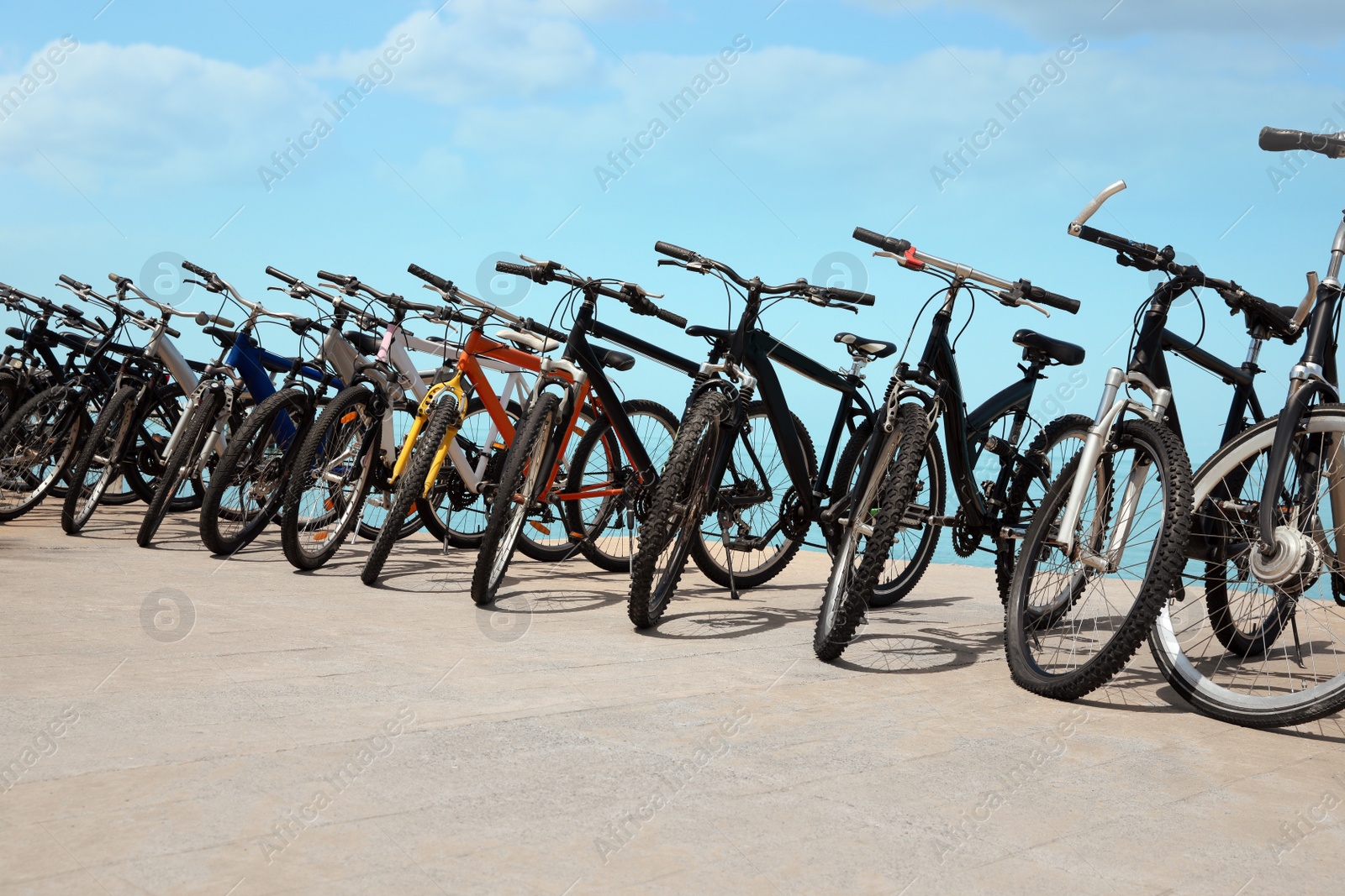 Photo of Parking with bicycles outdoors on sunny day