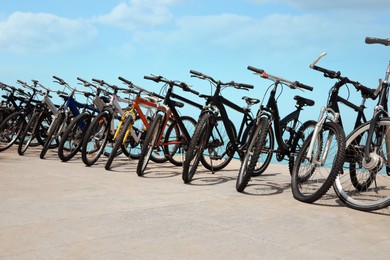 Photo of Parking with bicycles outdoors on sunny day