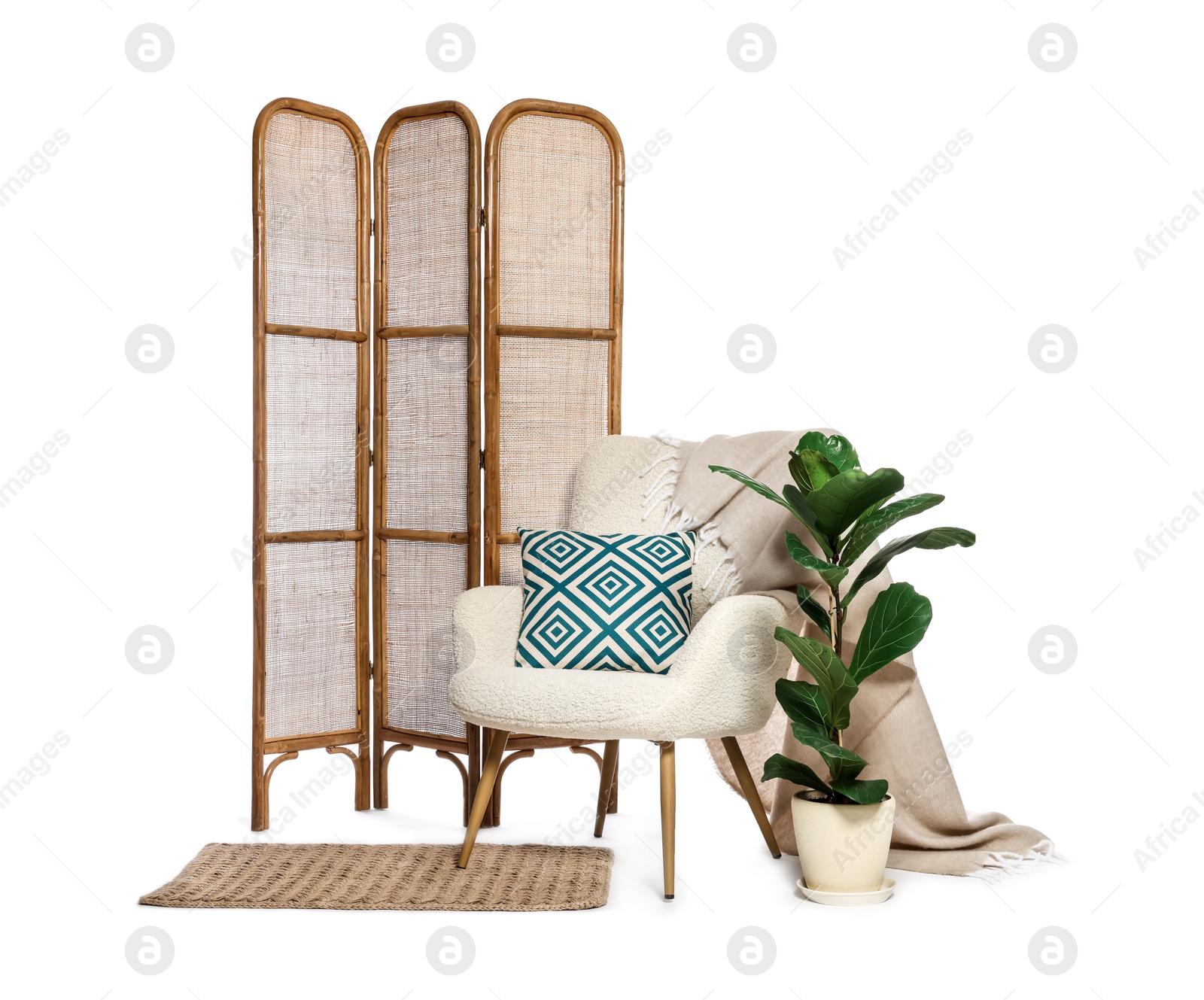 Photo of Stylish comfortable armchair, pillow, blanket, houseplant, folding screen and rug isolated on white