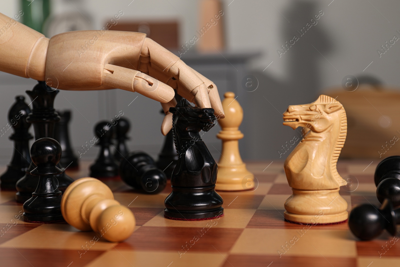 Photo of Robot moving chess piece on board, closeup. Wooden hand representing artificial intelligence