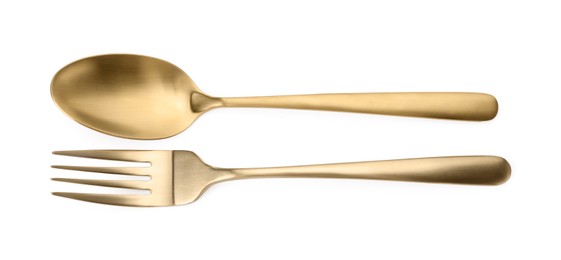 Photo of Shiny golden fork and spoon isolated on white, top view. Luxury cutlery