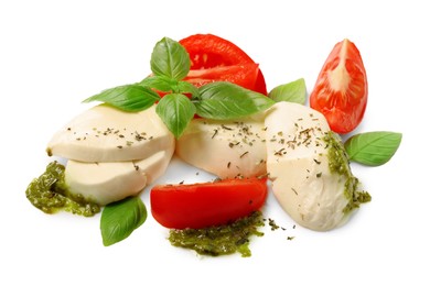 Tasty salad Caprese with mozzarella, tomatoes, basil and pesto sauce isolated on white