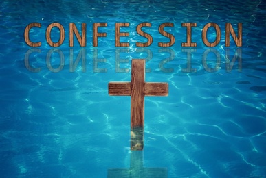 Image of Word Confession near wooden Christian cross in water