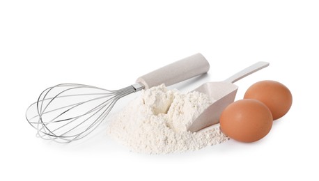 Photo of Whisk, raw eggs, flour and scoop isolated on white