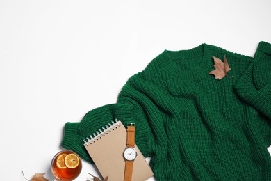 Photo of Flat lay composition with soft knitted sweater on white background