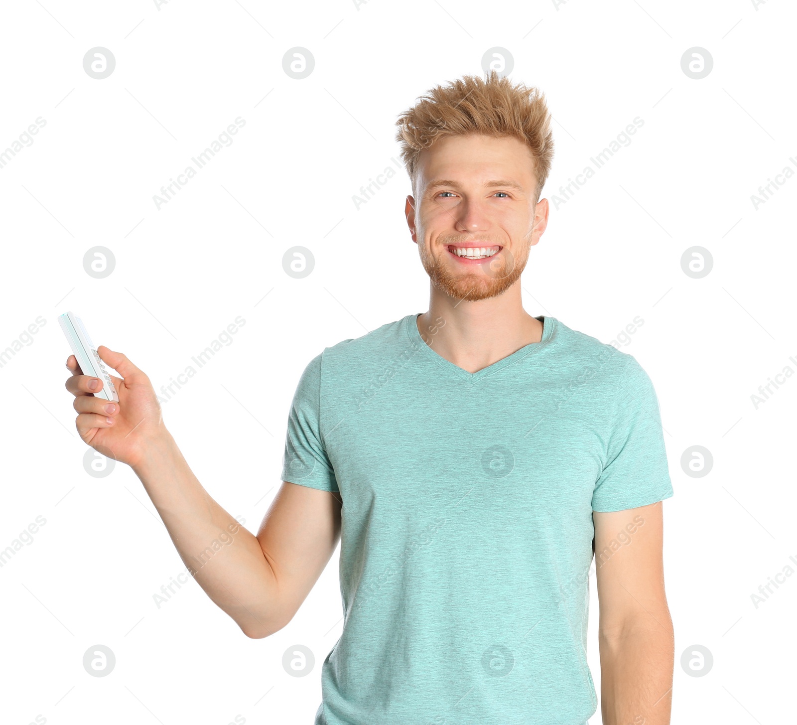 Photo of Young man with air conditioner remote on white background