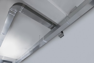 Photo of Ceiling with ventilation system indoors, bottom view