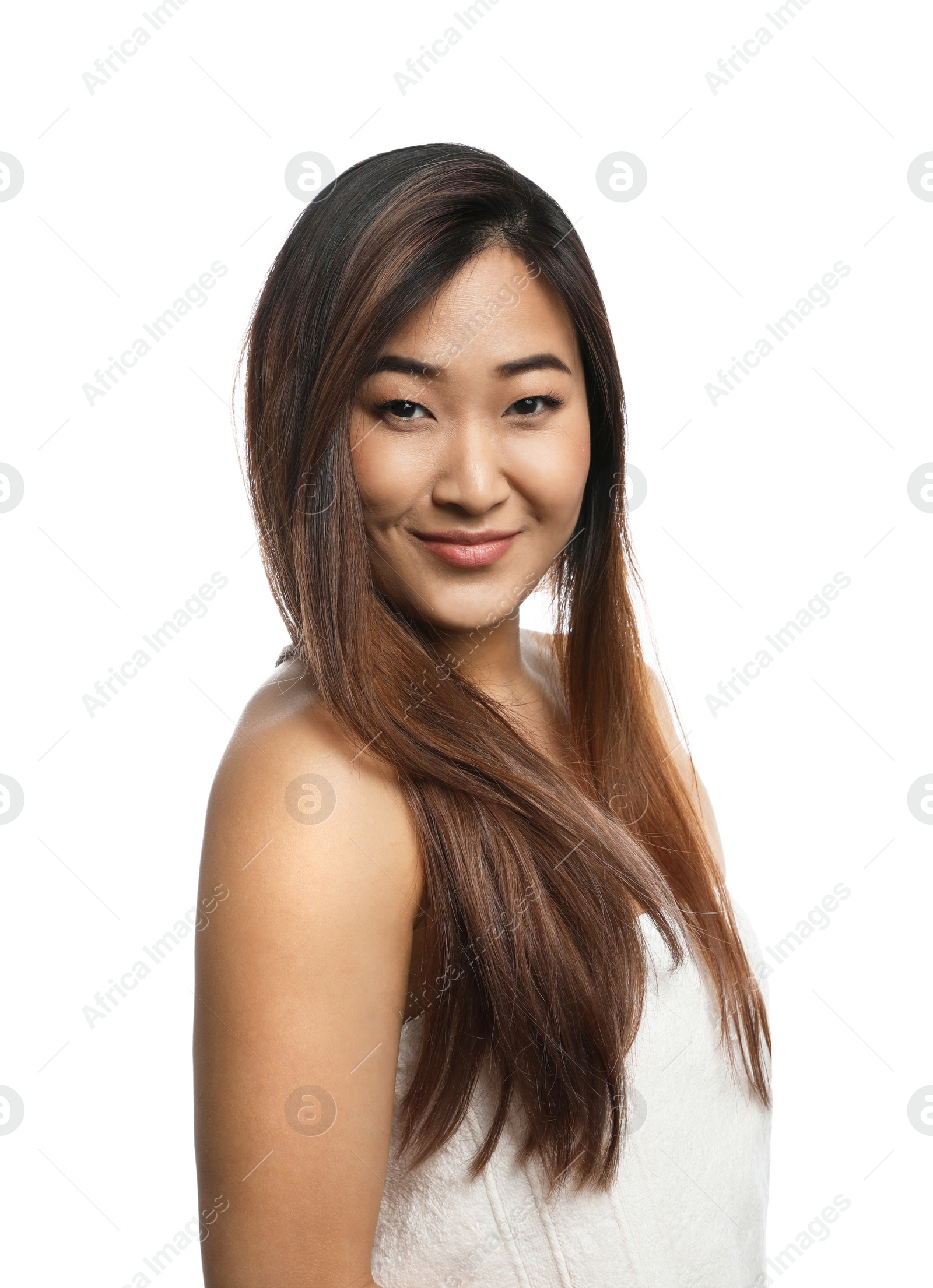 Photo of Portrait of beautiful Asian woman wrapped in towel isolated on white. Spa treatment