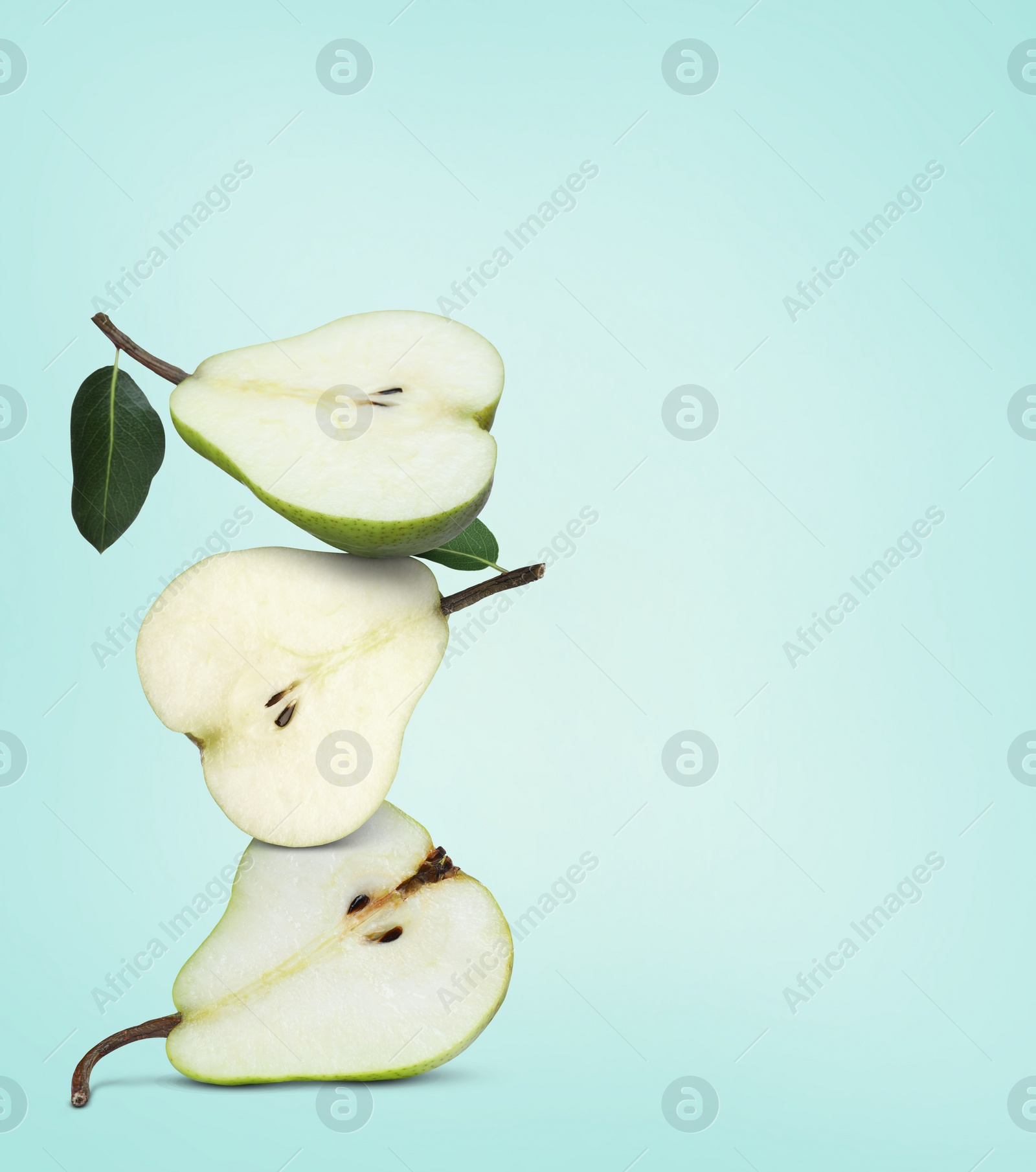 Image of Cut fresh ripe pears on light blue background, space for text