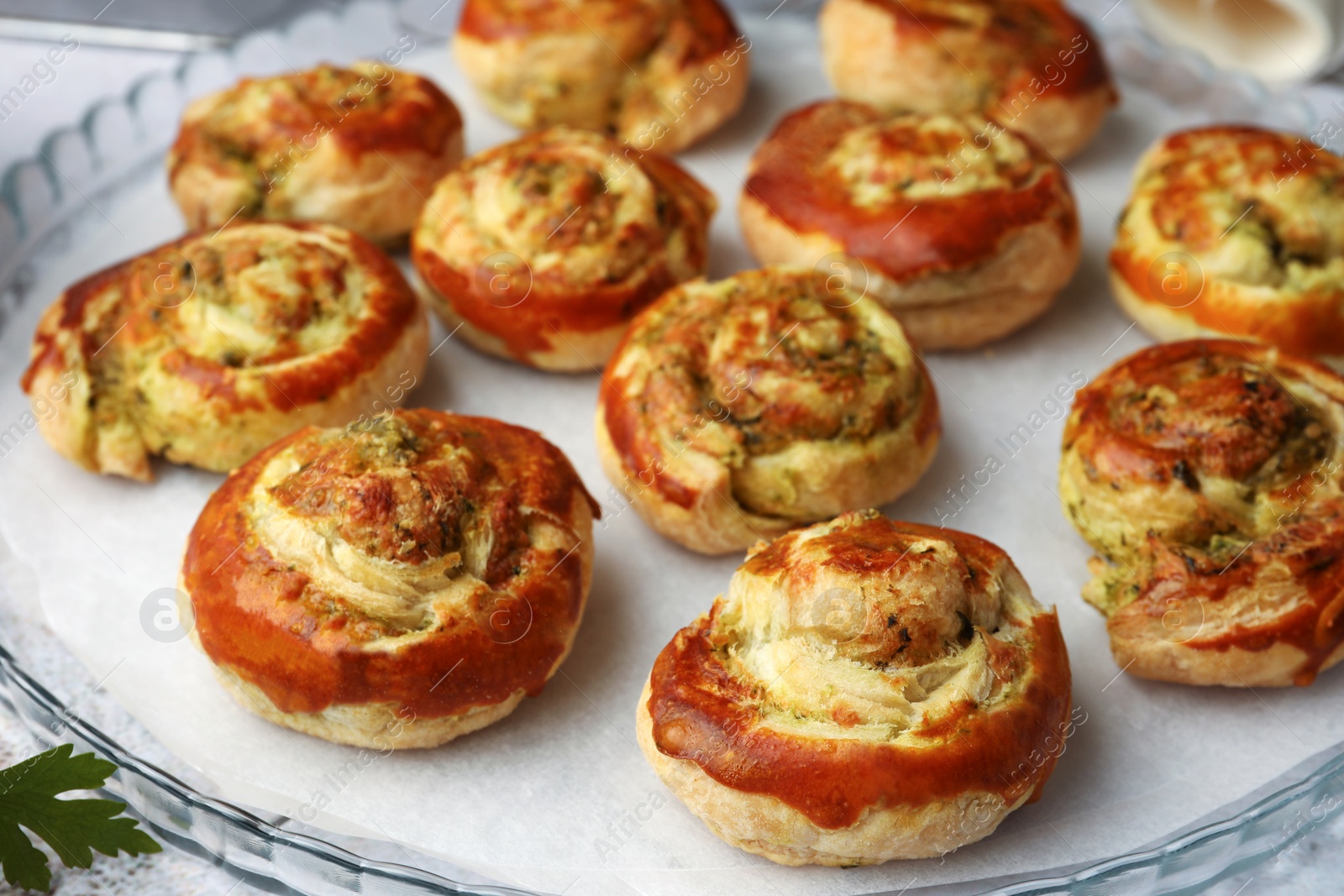 Photo of Fresh delicious puff pastry with tasty filling on tray, closeup