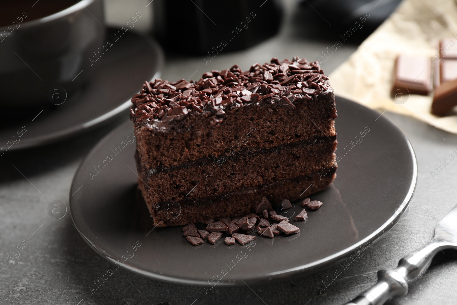 Photo of Delicious fresh chocolate cake served on table, closeup