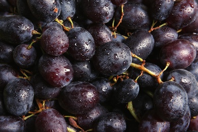 Photo of Fresh ripe juicy grapes as background, closeup