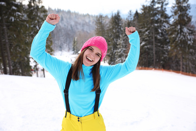 Photo of Young woman at mountain resort. Winter vacation