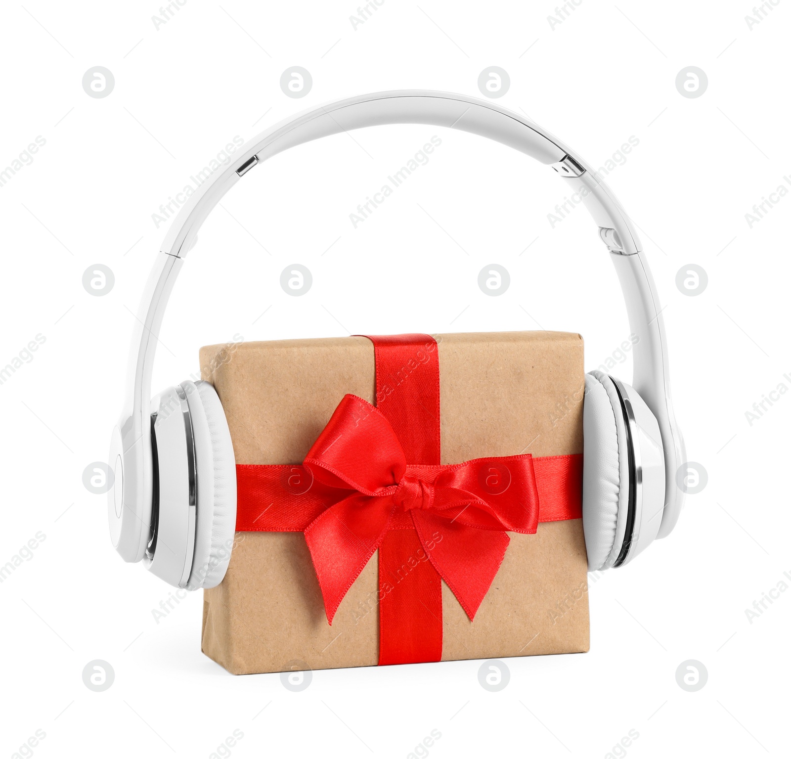 Photo of Gift box with headphones isolated on white. Christmas music concept