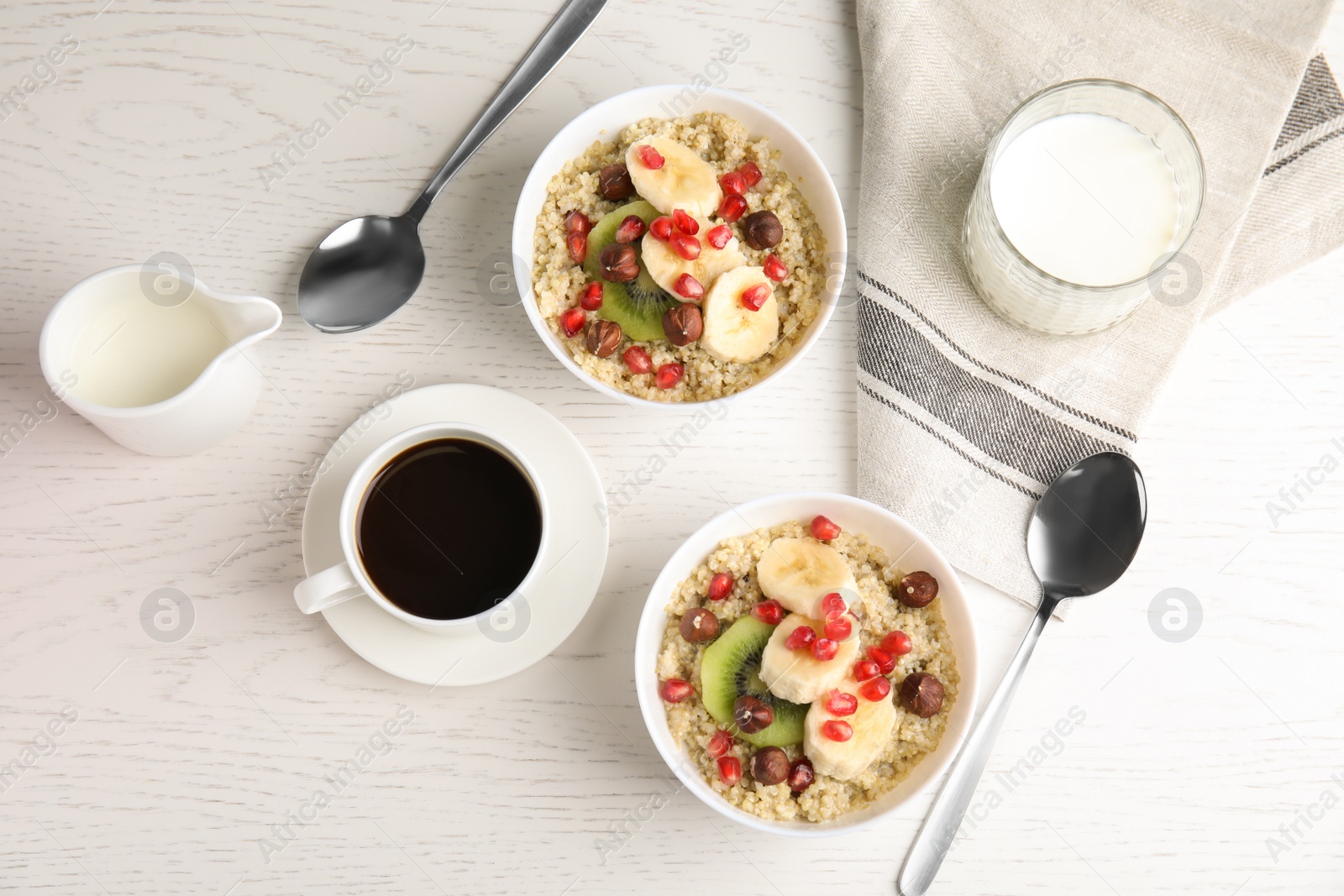 Photo of Flat lay composition with quinoa porridge and coffee on wooden background. Tasty breakfast