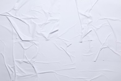 Photo of White crumpled sheet of paper as background, top view. Wall poster