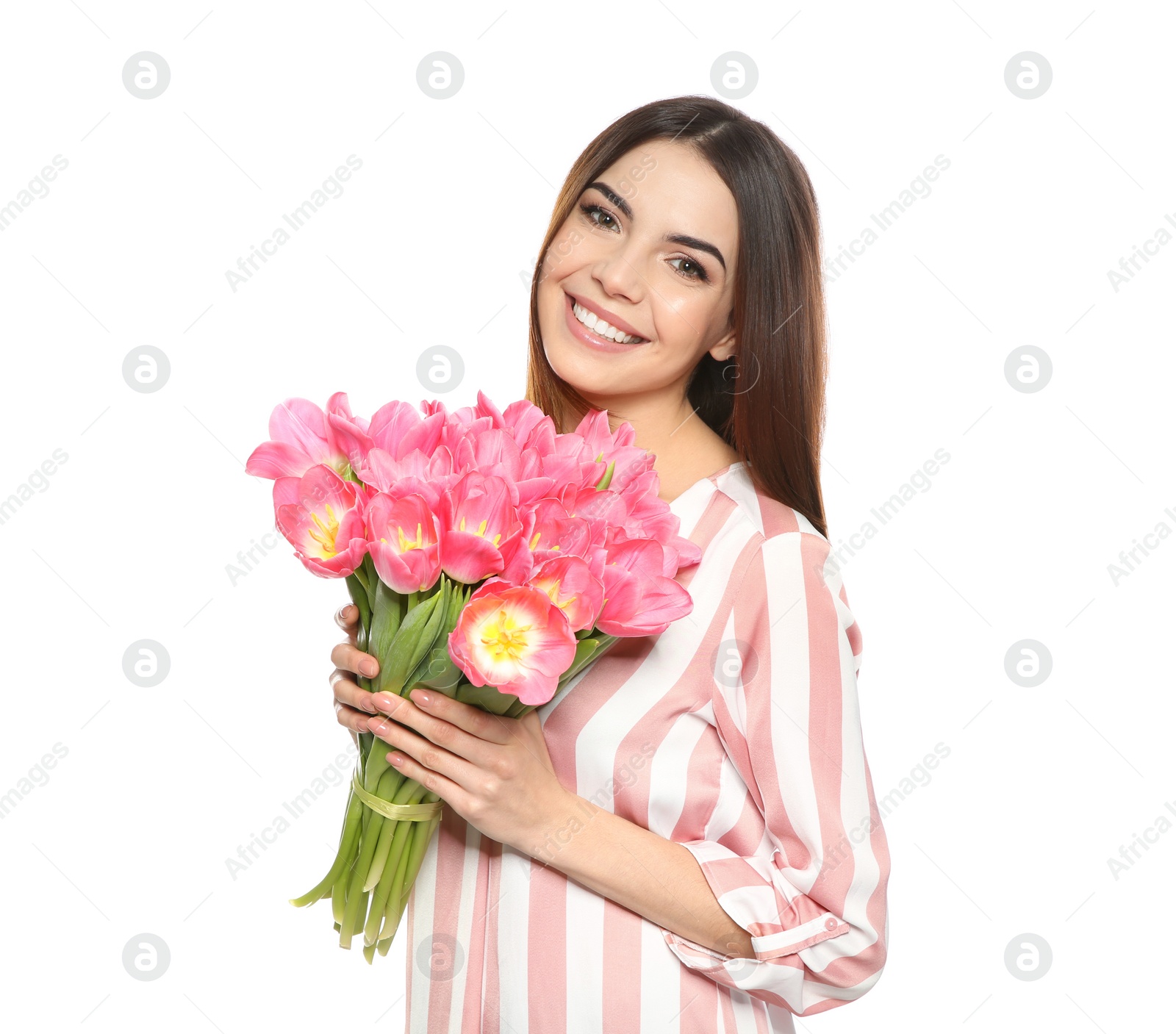 Photo of Portrait of smiling young girl with beautiful tulips on white background. International Women's Day