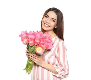 Portrait of smiling young girl with beautiful tulips on white background. International Women's Day