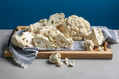 Fresh raw cauliflower on light grey table