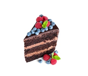 Piece of delicious chocolate cake decorated with fresh berries on white background