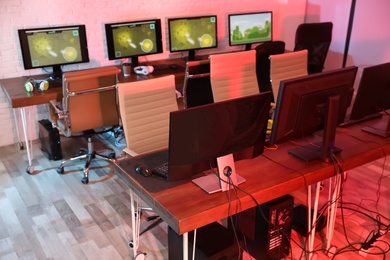 Photo of Internet cafe with modern computers for playing video games