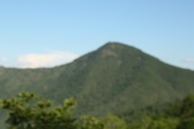 Photo of Big mountain under cloudy sky, blurred view