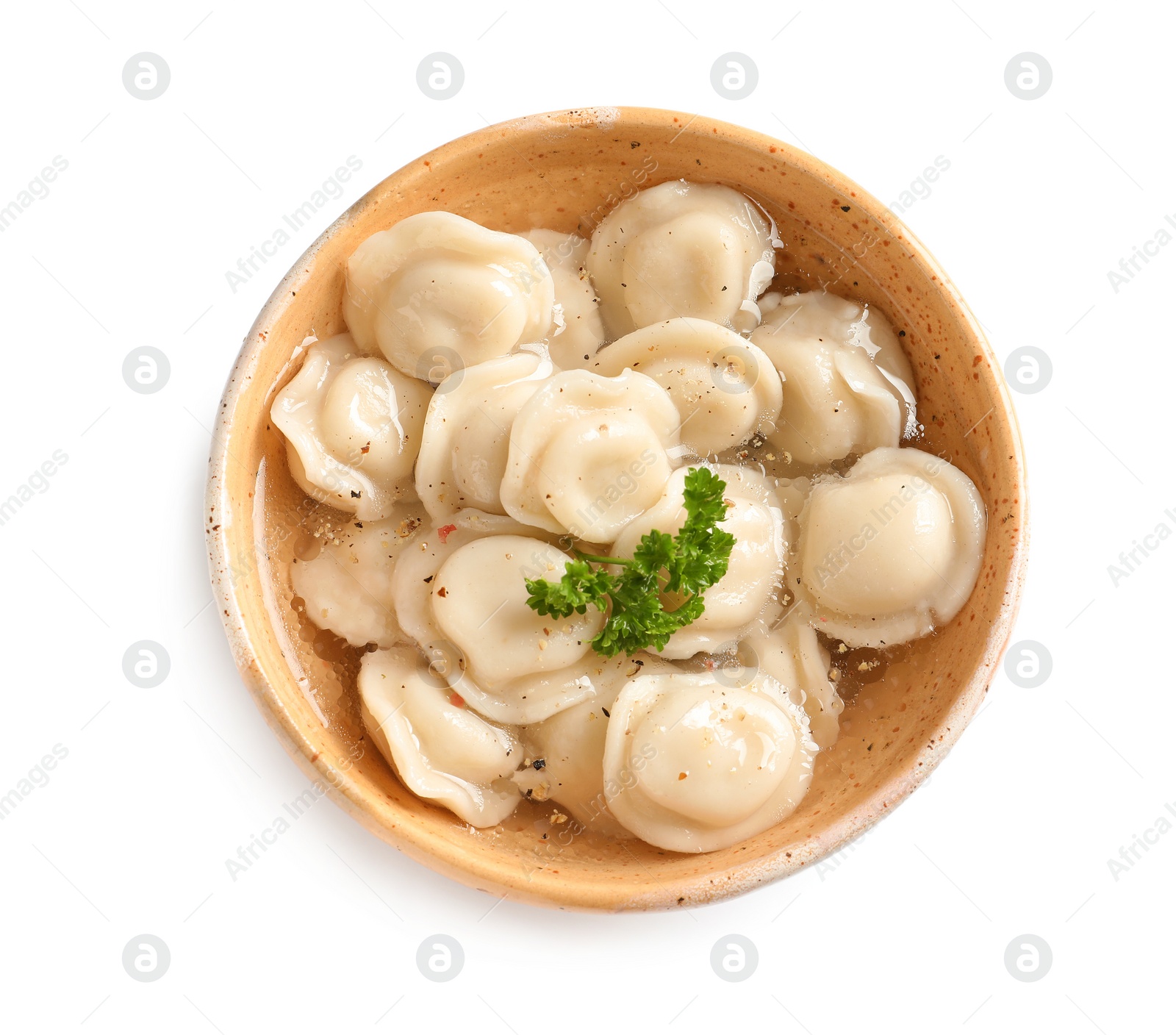 Photo of Bowl of tasty dumplings in broth isolated on white, top view