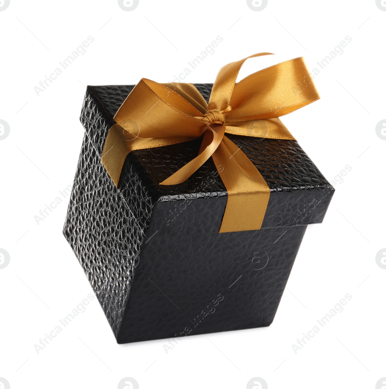 Photo of Beautiful black gift box with golden bow on white background