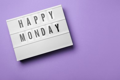 Photo of Light box with message Happy Monday on lilac background, top view. Space for text