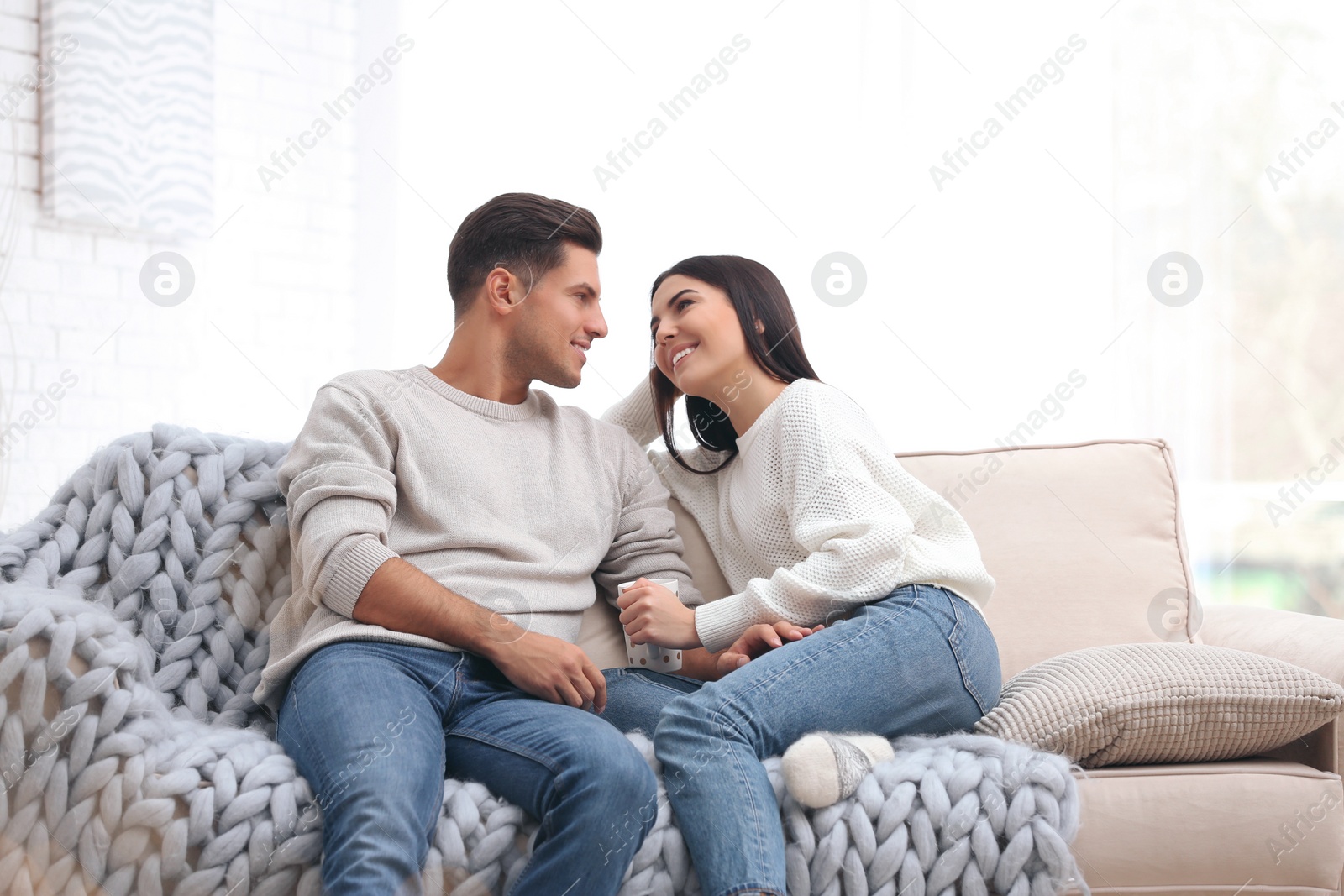 Photo of Happy couple spending time together at home. Winter vacation